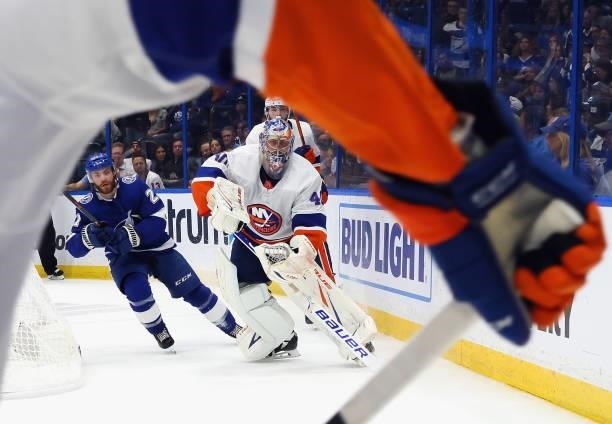 Semyon Varlamov of the New York Islanders controls the puck against the Tampa Bay Lightning in Game Two of the Stanley Cup Semifinals during the 2021...