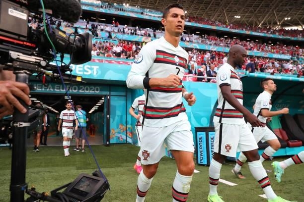 Cristiano Ronaldo of Portugal runs out for the second half past a tv cameraman during the UEFA Euro 2020 Championship Group F match between Hungary...