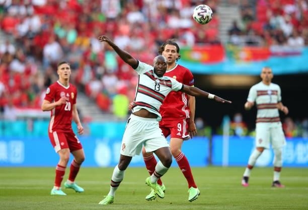 Danilo Pereira of Portugal wins the ball from Adam Szalai of Hungary during the UEFA Euro 2020 Championship Group F match between Hungary and...