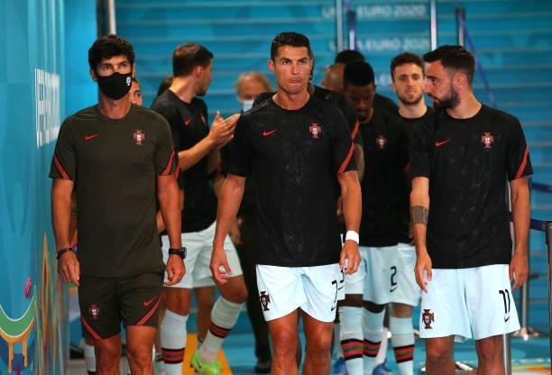 Cristiano Ronaldo and Bruno Fernandes of Portugal wait to enter the pitch prior to the UEFA Euro 2020 Championship Group F match between Hungary and...