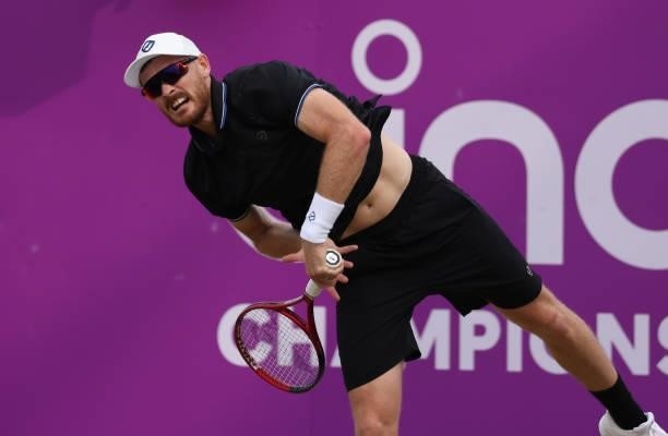 Jamie Murray of Great Britain, playing partner of Bruno Soares of Brazil serves during there Round of 16 match against Aslan Karatsev of Russia and...