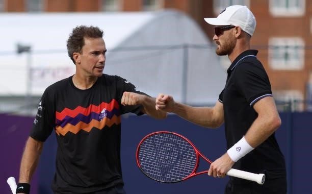 Jamie Murray of Great Britain, and Bruno Soares of Brazil interact during there Round of 16 match against Aslan Karatsev of Russia and Max Purcell of...