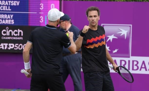 Jamie Murray of Great Britain, and Bruno Soares of Brazil interact during there Round of 16 match against Aslan Karatsev of Russia and Max Purcell of...