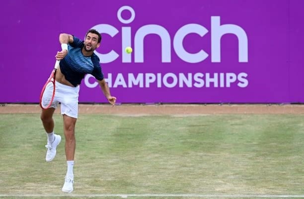 Marin Čilić of Croatia serves during his Round of 16 match against Fabio Fognini of Italy during Day 3 of The cinch Championships at The Queen's Club...