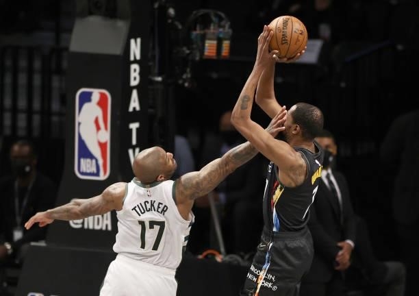 Kevin Durant of the Brooklyn Nets is fouled by P.J. Tucker of the Milwaukee Bucks during game 5 of the Eastern Conference second round at Barclays...