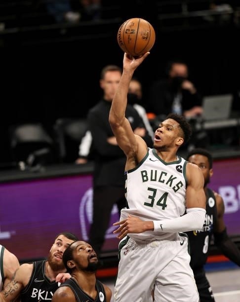 Giannis Antetokounmpo of the Milwaukee Bucks heads for the net as Kevin Durant of the Brooklyn Nets defends during game 5 of the Eastern Conference...
