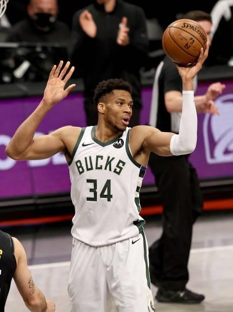 Giannis Antetokounmpo of the Milwaukee Bucks reacts after he is called for an offensive foul in the first half against the Brooklyn Nets during game...