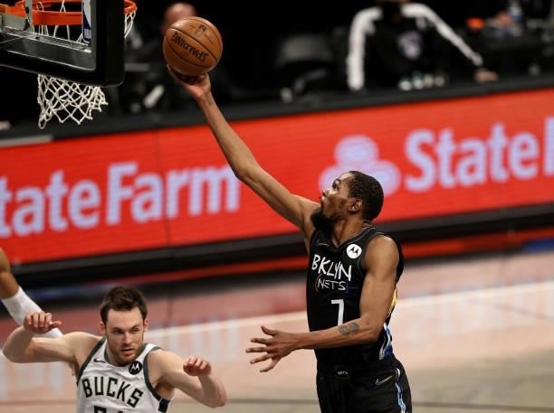 Kevin Durant of the Brooklyn Nets heads for the net as Pat Connaughton of the Milwaukee Bucks defends during game 5 of the Eastern Conference second...