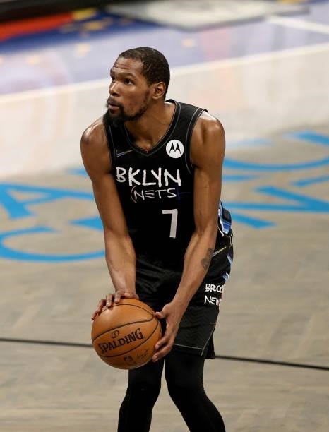 Kevin Durant of the Brooklyn Nets shoots a free throw in the fourth quarter against the Milwaukee Bucks during game 5 of the Eastern Conference...