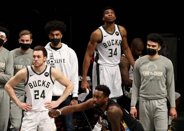 Giannis Antetokounmpo and Pat Connaughton of the Milwaukee Bucks react to the loss of during game 5 of the Eastern Conference second round to the...