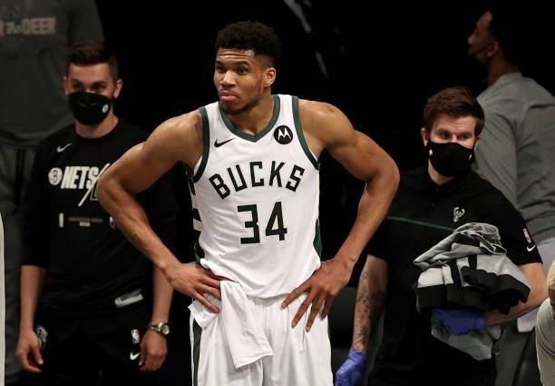 Giannis Antetokounmpo of the Milwaukee Bucks reacts as he is on the bench after his sixth foul against the Brooklyn Nets during game 5 of the Eastern...