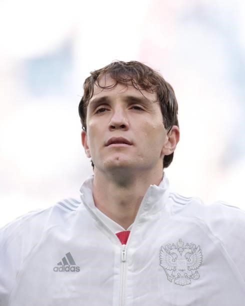 Mario Fernandes of Russia sings their national anthem prior to start the UEFA Euro 2020 Championship Group B match between Finland and Russia at...