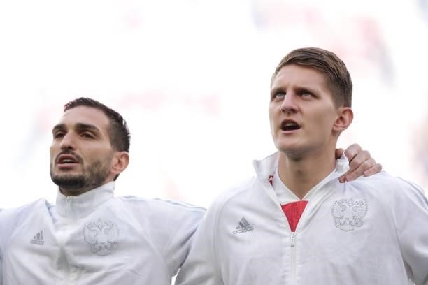 Magomed Ozdoev of Russia and his teammate Igor Diveev sing their national anthem prior to start the UEFA Euro 2020 Championship Group B match between...