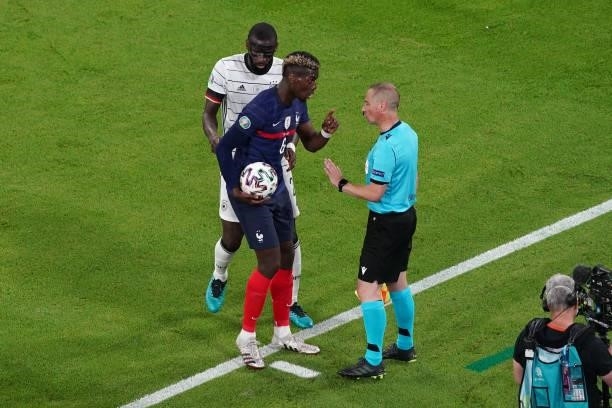 Joshua Kimmich of Germany discussing with the assistant referee during the UEFA Euro 2020 match between France and Germany at Allianz Arena on June...