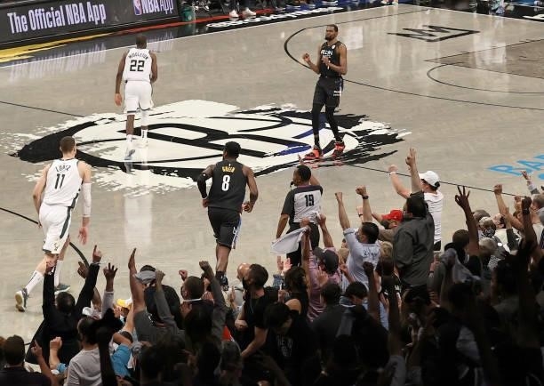Jeff Green of the Brooklyn Nets celebrates his three with teammate Kevin Durant and the fans late in the fourth quarter against the Milwaukee Bucks...