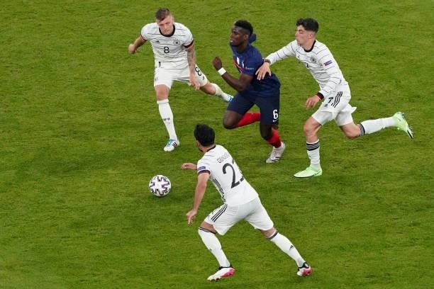 Ilkay Gundogan of Germany, Toni Kroos of Germany, Paul Pogba of France during the UEFA Euro 2020 match between France and Germany at Allianz Arena on...