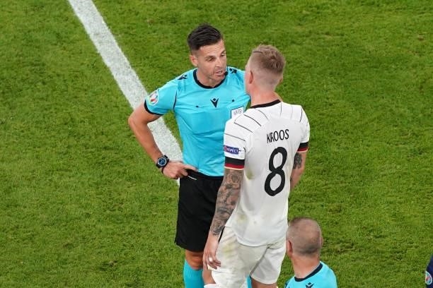 Referee Carlos Del Cerro Grande, Toni Kroos of Germany during the UEFA Euro 2020 match between France and Germany at Allianz Arena on June 15, 2021...