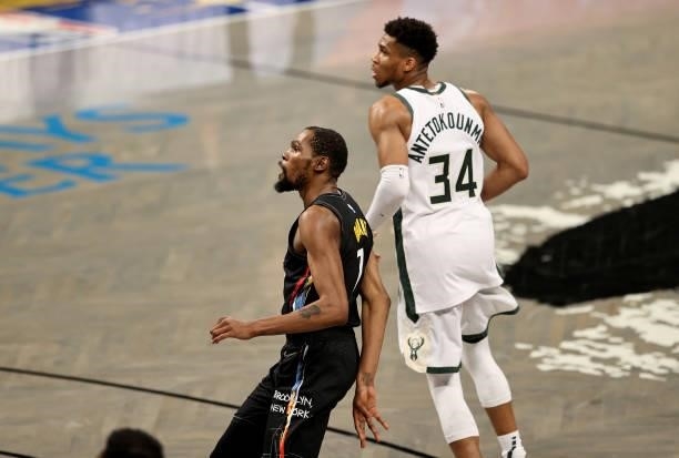 Kevin Durant of the Brooklyn Nets watches his shot as Giannis Antetokounmpo of the Milwaukee Bucks defends in the second half during game 5 of the...