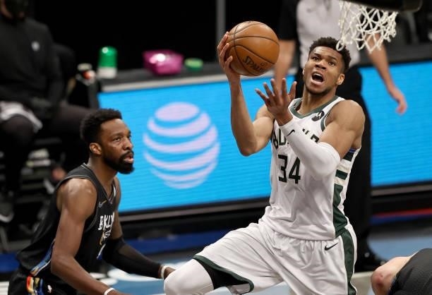 Giannis Antetokounmpo of the Milwaukee Bucks heads for the net as Jeff Green of the Brooklyn Nets defends in the first half during game 5 of the...