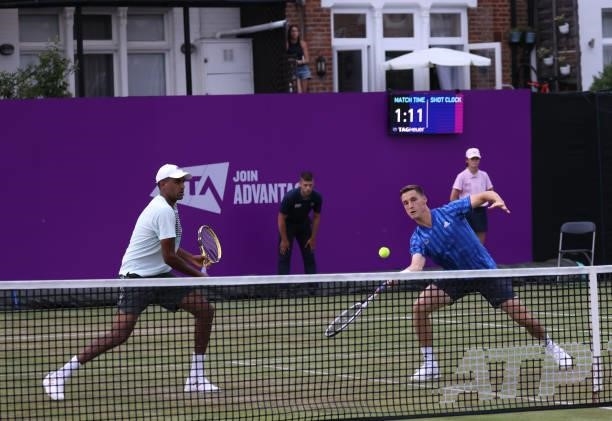 Joe Salisbury of Great Britain, playing partner of Rajeev Ram of USA plays a forehand during there Round of 16 match against Alex de Minaur of...
