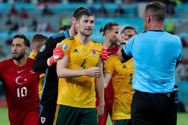 Ben Davies of Wales and referee Artur Dias during the UEFA Euro 2020 Championship Group A match between Turkey National Team and Wales National Team...