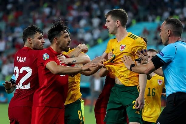 Kaan Ayhan of Turkey, Irfan Can Kahveci of Turkey and Chris Mepham of Wales during the UEFA Euro 2020 Championship Group A match between Turkey...