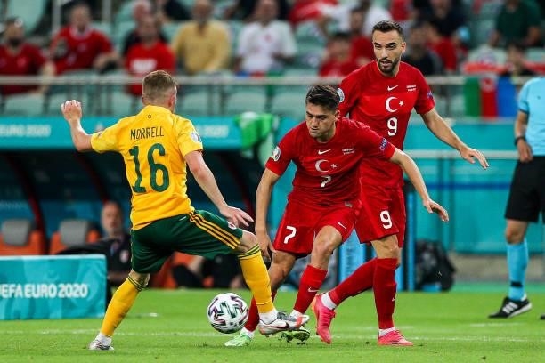 Cengiz Ünder of Turkey fights for the ball with Joe Morrell of Wales during the UEFA Euro 2020 Championship Group A match between Turkey and Wales at...