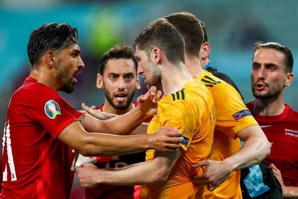 Kaan Ayhan of Turkey, Irfan Can Kahveci of Turkey and Chris Mepham of Wales clash during the UEFA Euro 2020 Championship Group A match between Turkey...