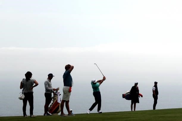 Dustin Johnson of the United States plays a shot during a practice round prior to the start of the 2021 U.S. Open at Torrey Pines Golf Course on June...