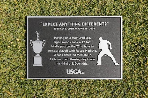 New plaque honoring Tiger Woods' putt on the 18th green at the 2008 U.S. Open is seen during a practice round prior to the start of the 2021 U.S....