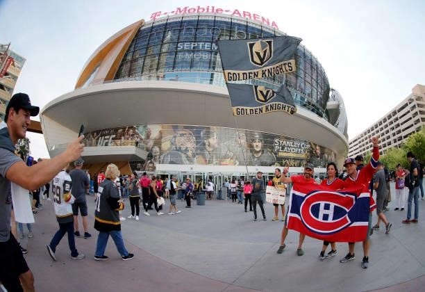 Montreal Canadiens fans Rich Lenkov of Illinois, and Terri Thomas and Jesse Rice, both of Canada, pose for photos as they arrive at Game Two of the...