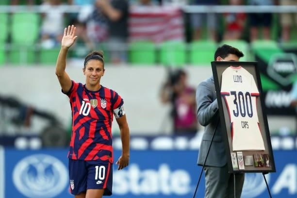 Carli Lloyd of United States greets fans as she receives a recognition of 300 games with her team prior the Summer Series game between United States...