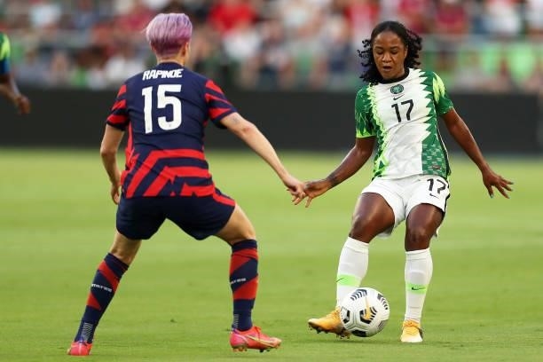 Francisca Ordega of Nigeria controls the ball against Megan Rapinoe of United States during the Summer Series game between United States and Nigeria...