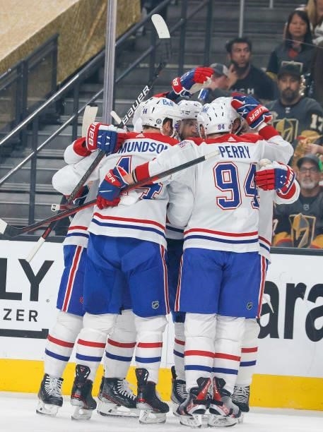 Joel Armia of the Montreal Canadiens is congratulated by his teammates after scoring a goal against the Vegas Golden Knights during the first period...