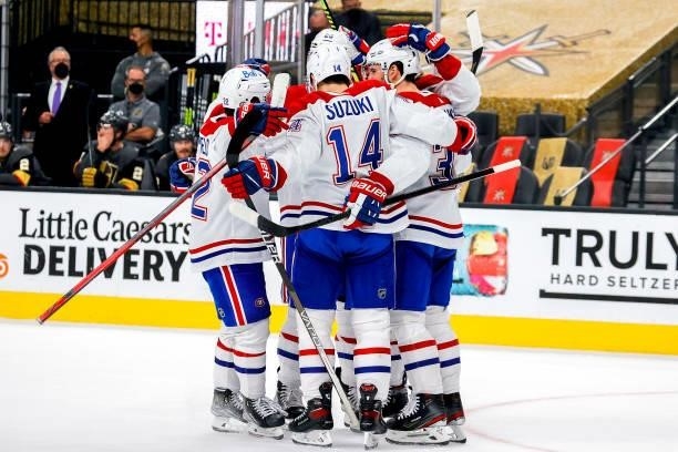 Tyler Toffoli of the Montreal Canadiens is congratulated by his teammates after scoring a goal against the Vegas Golden Knights during the first...