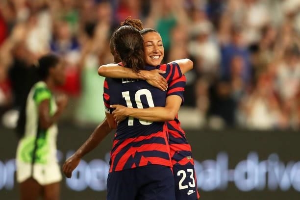 Christen Press of United States celebrates with teammate Carli Lloyd after scoring the first goal of her team during the Summer Series game between...