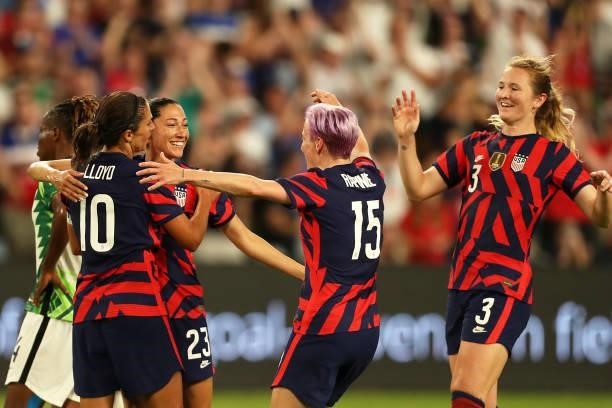 Christen Press of United States celebrates with teammates after scoring the first goal of her team during the Summer Series game between United...