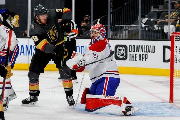 Carey Price of the Montreal Canadiens makes the save as Patrick Brown of the Vegas Golden Knights attempts to deflect the shot during the second...