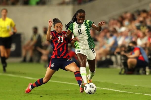Christen Press of United States and Toni Payne of Nigeria fight the ball during the Summer Series game between United States and Nigeria at Q2...