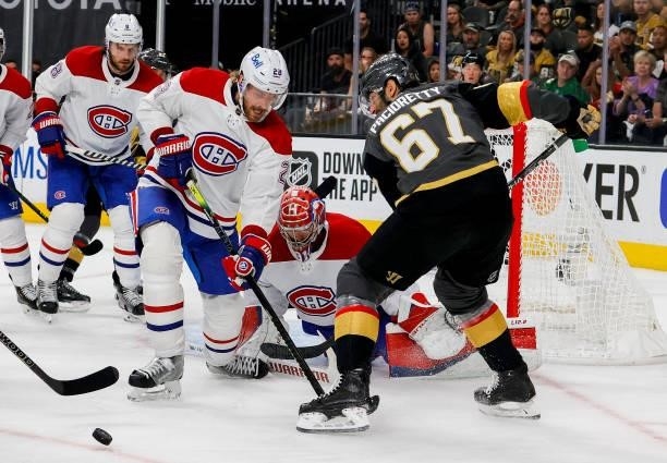 Jon Merrill of the Montreal Canadiens and Max Pacioretty of the Vegas Golden Knights battle for the puck during the second period in Game Two of the...
