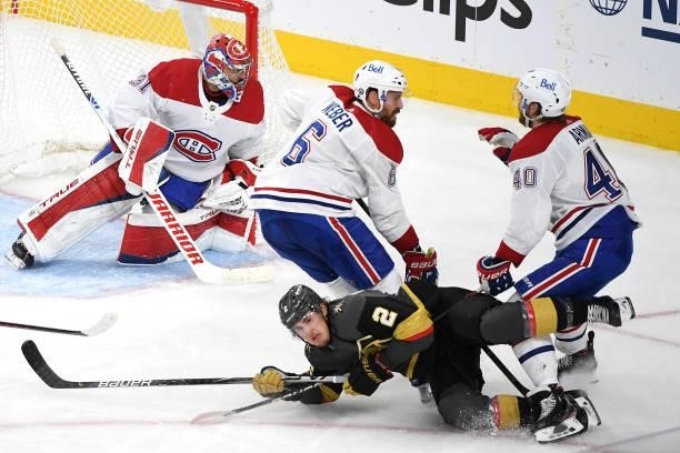 Joel Armia of the Montreal Canadiens is called for a holding penalty on Zach Whitecloud of the Vegas Golden Knights during the second period in Game...