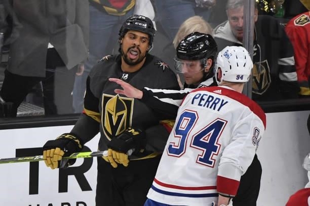 Ryan Reaves of the Vegas Golden Knights and Corey Perry of the Montreal Canadiens exchange words after a scuffle in the second period in Game Two of...
