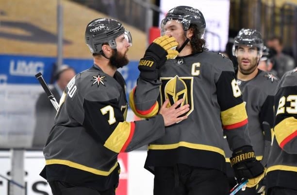 Alex Pietrangelo and Mark Stone of the Vegas Golden Knights talk during a stoppage in play during the third period against the Montreal Canadiens in...