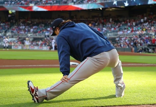 Hirokazu Sawamura of the Boston Red Sox stretches prior to facing the Atlanta Braves at Truist Park on June 16, 2021 in Atlanta, Georgia.