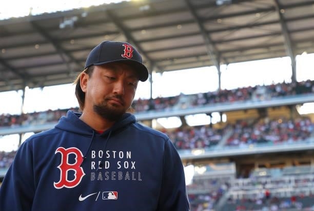 Hirokazu Sawamura of the Boston Red Sox walks into the dugout prior to facing the Atlanta Braves at Truist Park on June 16, 2021 in Atlanta, Georgia.