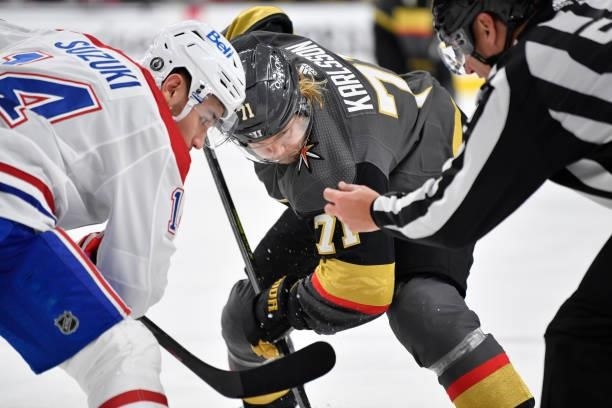 William Karlsson of the Vegas Golden Knights faces off with Nick Suzuki of the Montreal Canadiens during the third period in Game Two of the Stanley...