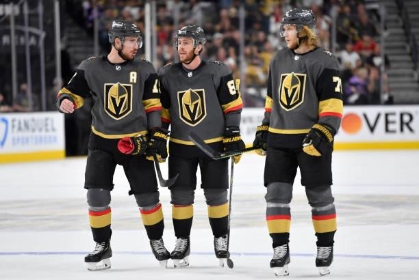 Reilly Smith, Jonathan Marchessault, and William Karlsson of the Vegas Golden Knights talk during a stoppage in play during the third period against...