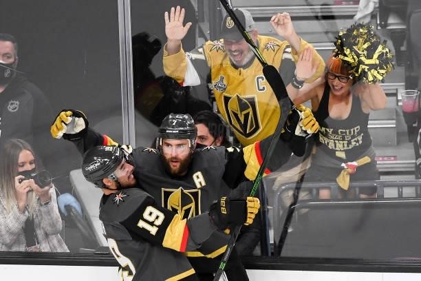 Alex Pietrangelo of the Vegas Golden Knights is congratulated by Reilly Smith after scoring a goal against the Montreal Canadiens during the third...