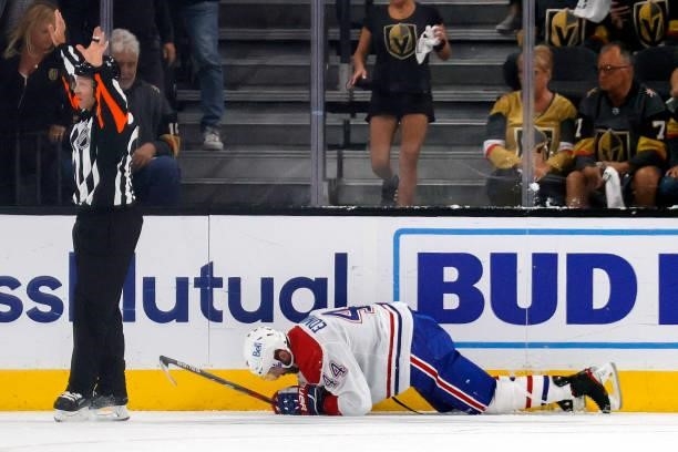 Joel Edmundson of the Montreal Canadiens gets tripped up against the Vegas Golden Knights during the third period in Game Two of the Stanley Cup...