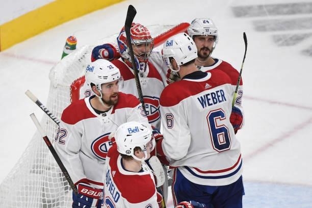 Carey Price of the Montreal Canadiens is congratulated by teammates Erik Gustafsson, Shea Weber and Phillip Danault after the team's 3-2 victory over...